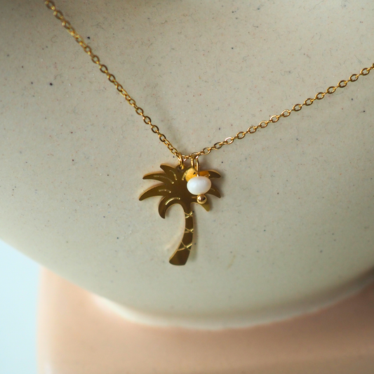 Palmboom ketting goud, detail van bedel en parel